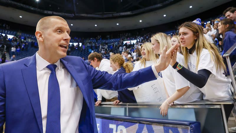 BYU’s head coach Mark Pope high-fives fans after the Cougars beat the Nicholls State Colonels at the Marriott Center in Provo on Saturday, Nov. 19, 2022. On Thursday, the Big 12 announced schedule details for the 2023-24 season.