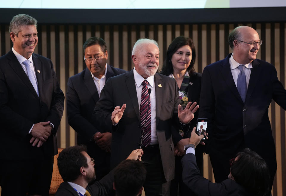 Brazilian President Luiz Inacio Lula da Silva, center, talks with the media as Bolivia's President Luis Arce looks on during the 63rd Mercosur Summit, in Rio de Janeiro, Brazil, Thursday, Dec. 7, 2023. (AP Photo/Silvia Izquierdo)