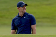 Rory McIlroy winks and smiles at the crowd after setting up a birdie putt with shot from the bunker on the 18th hole during the third round of the Zurich Classic golf tournament at TPC Louisiana in Avondale, La., Saturday, April 27, 2024. (AP Photo/Matthew Hinton)