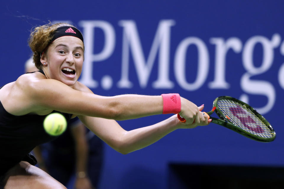 Jelena Ostapenko, of Latvia, returns a shot to Maria Sharapova, of Russia, during the third round of the U.S. Open tennis tournament, Saturday, Sept. 1, 2018, in New York. (AP Photo/Adam Hunger)