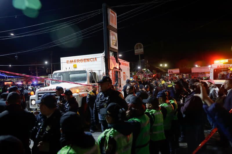 Police officers work outside the Tacubaya metro station after trains collided, in Mexico City