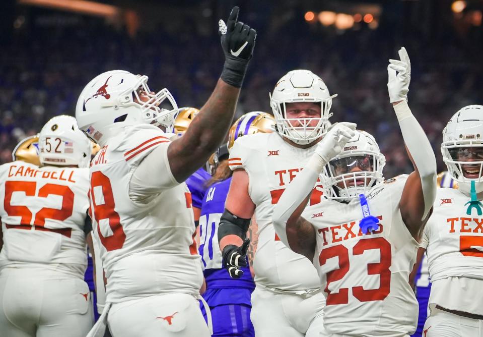 Texas running back Jaydon Blue celebrates his 2-yard touchdown in the first quarter of Monday's Sugar Bowl against Washington.