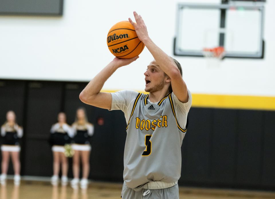 The College of Wooster's Carter Warstler knocks down a 3 in the Scots' 86-56 season-opening win.