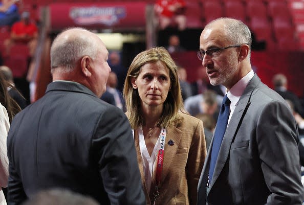 MONTREAL, QUEBEC - JULY 08: (L-R) Bruce Boudreau and Cammi Granato of the Vancouver Canuks speak with Don Granato of the Buffalo Sabres at the 2022 NHL Draft at the Bell Centre on July 08, 2022 in Montreal, Quebec. (Photo by Bruce Bennett/Getty Images)