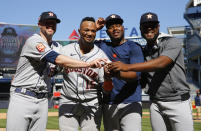 Houston Astros players, from left, relief pitcher Ryan Pressly, catcher Martin Maldonado, relief pitcher Hector Neris, and starting pitcher Cristian Javier celebrate after a combined no-hitter against the New York Yankees. Saturday, June 25, 2022, in New York. The Houston Astros won 3-0. (AP Photo/Noah K. Murray)