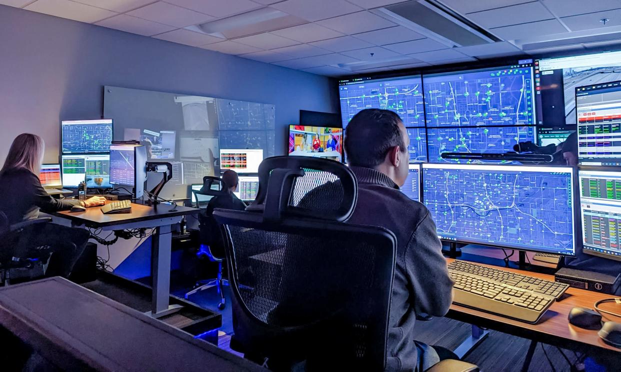 Analysts for the Oklahoma City Police Department toggle multiple screens earlier in December at the department's Real Time Information Center using its new integrated camera system.