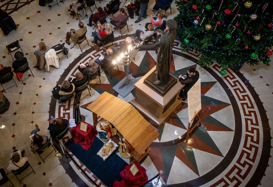 A Nativity scene joins a Christmas tree and a menorah on display in the rotunda of the Capitol during a ceremony hosted by the Springfield Nativity Scene Committee on Tuesday. [Justin L. Fowler/The State Journal-Register]