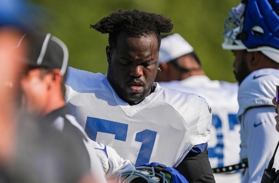 Indianapolis Colts defensive end Kwity Paye (51) adjusts his helmet Thursday, Aug. 17, 2023, during training camp at Grand Park Sports Campus in Westfield. 