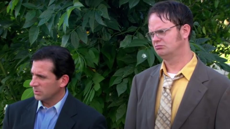 Michael and Dwight look at car in lake