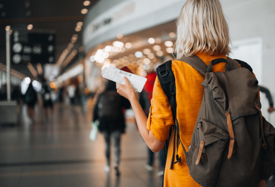 A woman with her plane ticket