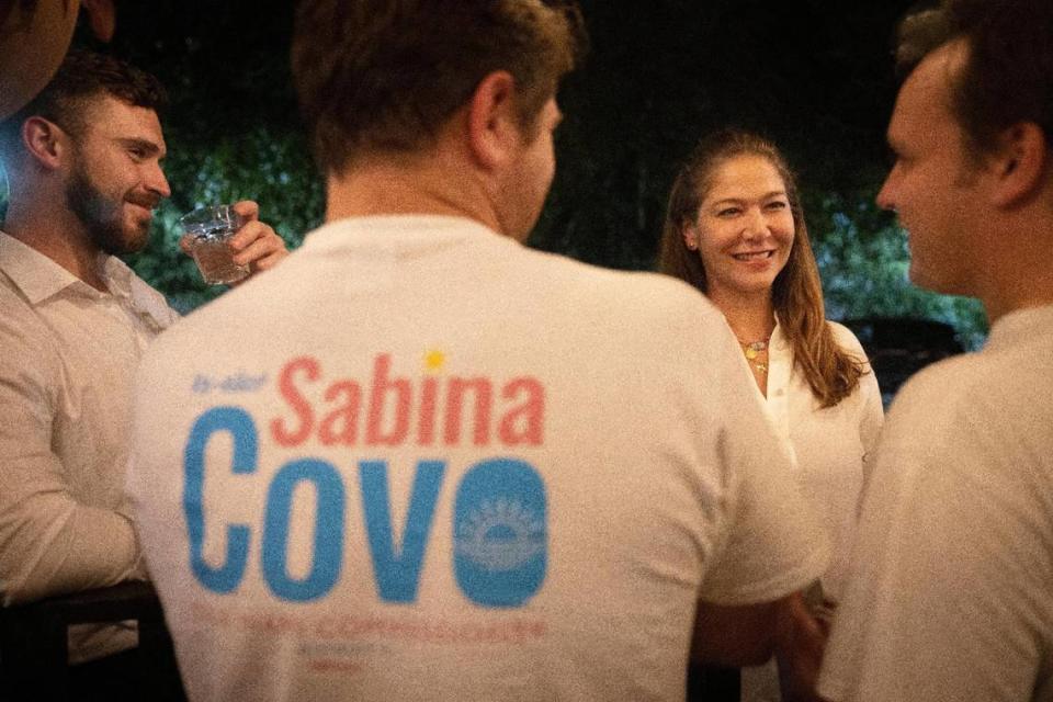 Sabina Covo, center, talks to supporters and members of her campaign team during her watch party on Tuesday, Nov. 7, 2023, at Taurus in Coconut Grove. She lost in the runoff two weeks later to opponent Damian Pardo.