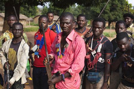 Militia fighters known as anti-balaka pose for a photograph in Mbakate village, Central African Republic November 25, 2013. REUTERS/Joe Penney