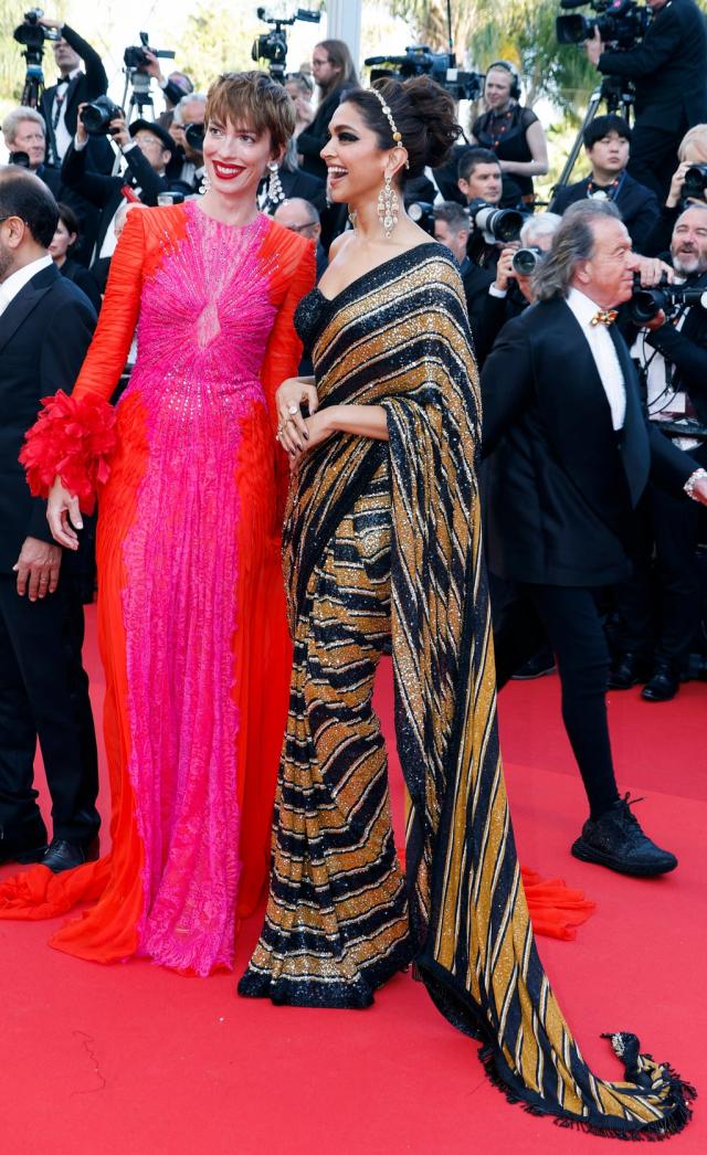 Models pose during the opening ceremony of a Louis Vuitton (LV