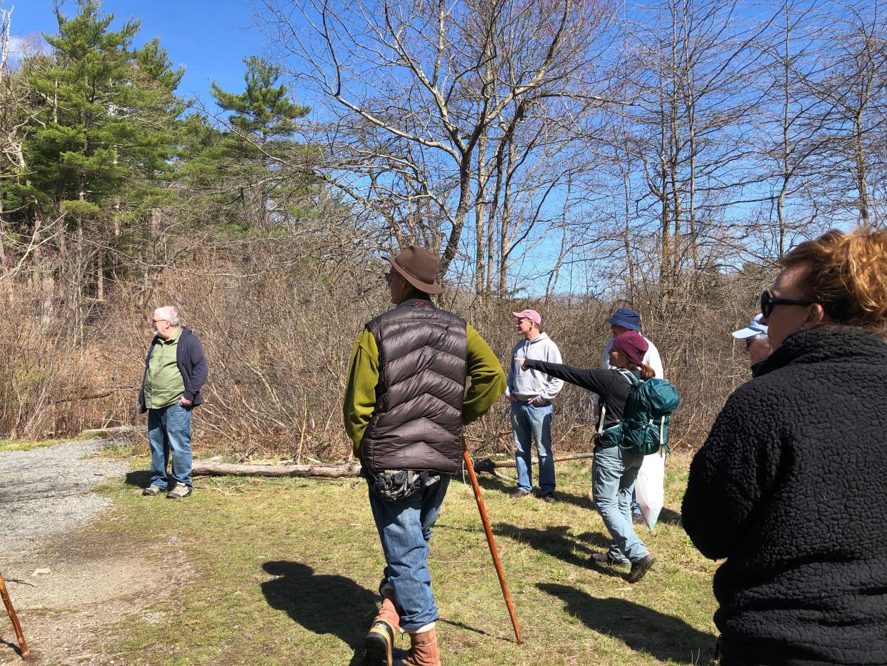 Maura O'Gara points out some natural features along the St. Moritz Pond Loop in West Quincy on an Environmental Treasures tour.