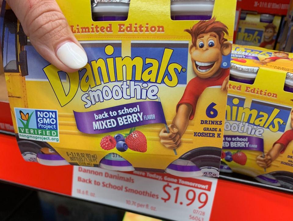 hand holding carton of danimals smoothies at aldi