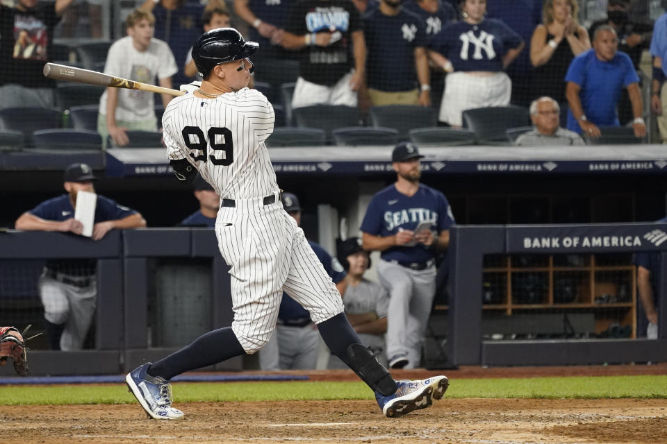 New York Yankees' Aaron Judge watches his RBI-sacrifice fly in the eighth inning to tie the game the baseball game against the Seattle Mariners, Friday, Aug. 6, 2021, in New York. (AP Photo/Mary Altaffer)
