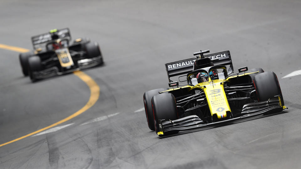 Daniel Ricciardo and Kevin Magnussen in action. (Photo by Mark Thompson/Getty Images)