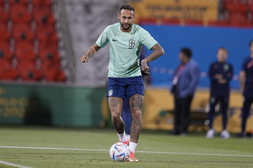 Brazil's Neymar practices during a training session at the Grand Hamad stadium in Doha, Qatar, Sunday, Dec. 4, 2022. Brazil will face South Korea in a World Cup round of 16 soccer match on Dec. 5. (AP Photo/Andre Penner)