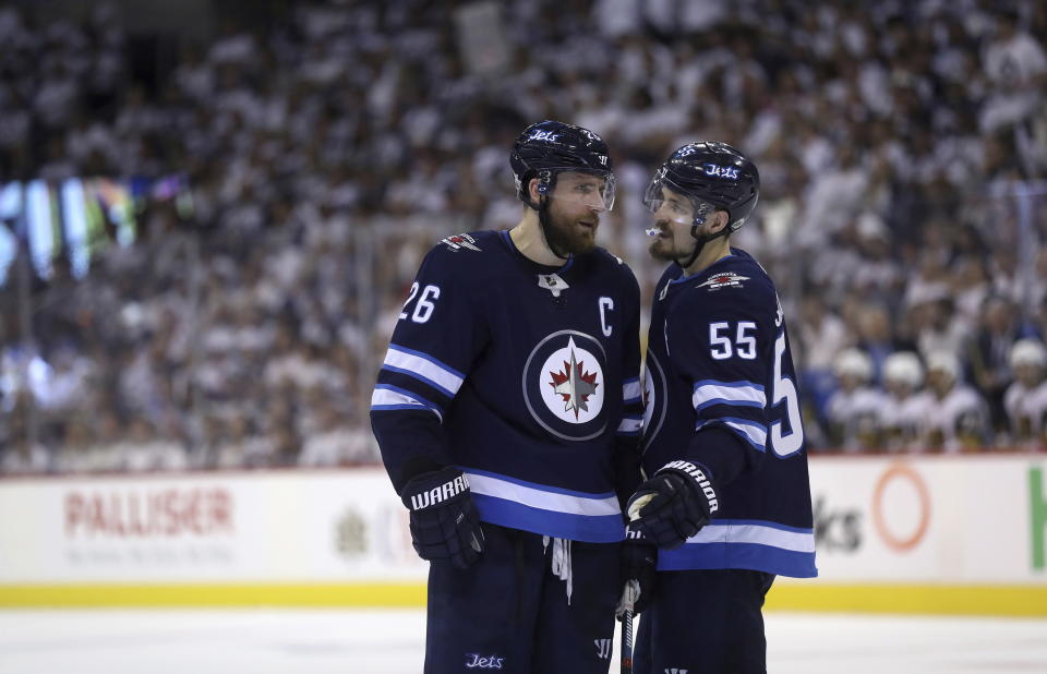 Winnipeg Jets’ Blake Wheeler (26) and Mark Scheifele (55) talk to each other during a time stoppage during second period NHL Western Conference Finals game 5 hockey action against the Vegas Golden Knights, in Winnipeg, Sunday, (Trevor Hagan/The Canadian Press via AP)