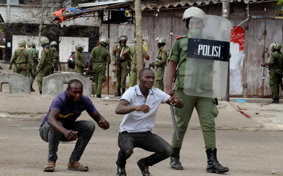 A police officer enforces pre-election laws during ongoing security operations prior to Tanzania's general elections, in Stone Town, Zanzibar, Tanzania, 27 October 2020.  - ANTHONY SIAME/EPA-EFE/Shutterstock /EPA