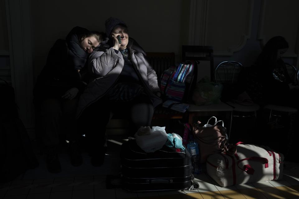 People who fled the war in Ukraine wait at the train station in Przemysl, southeastern Poland, Thursday, March 17, 2022. (AP Photo/Petros Giannakouris)