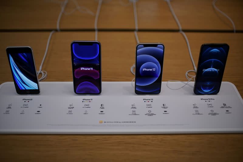 FILE PHOTO: Apple's 5G iPhone 12 and iPhone 11 are seen at an Apple Store in Shanghai