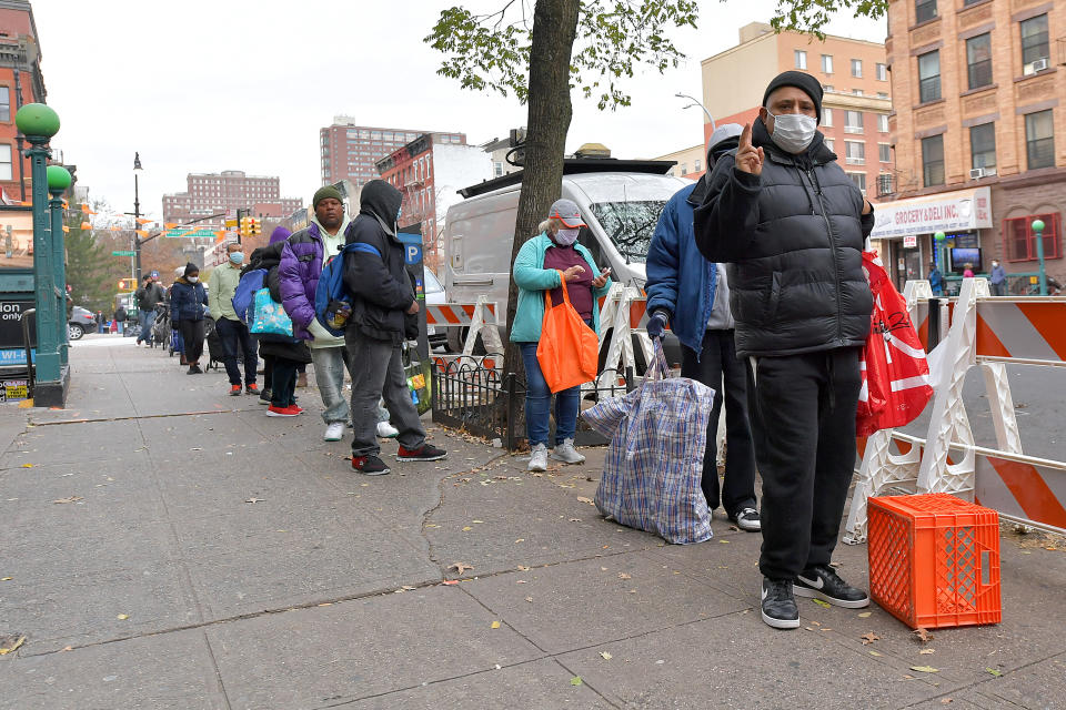 NEW YORK, NEW YORK - NOVEMBER 25: A view of the line as Food Bank For New York City distributes Thanksgiving meals to go at Food Bank Community Kitchen on November 25, 2020 in New York City. (Photo by Michael Loccisano/Getty Images for Food Bank For New York City)