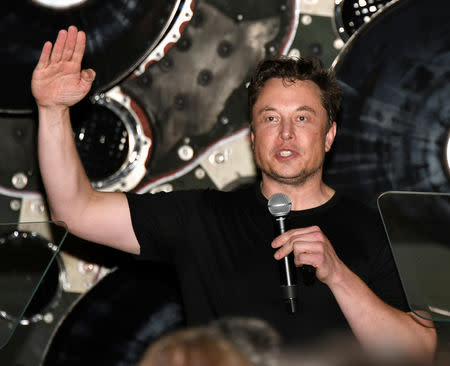 FILE PHOTO: SpaceX CEO Elon Musk talks to his workforce as he announces the world's first private passenger scheduled to fly around the Moon aboard SpaceX's BFR launch vehicle, at the company's headquarters in Hawthorne, California, U.S. September 17, 2018. REUTERS/Gene Blevins/File Photo