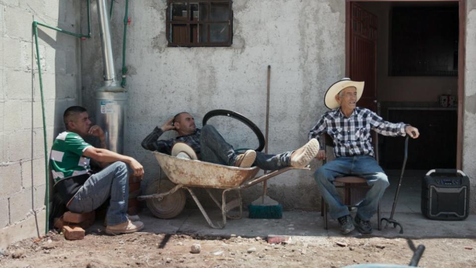 Julián Moreno takes a breather with workers constructing his house - Credit: Borderchild Productions