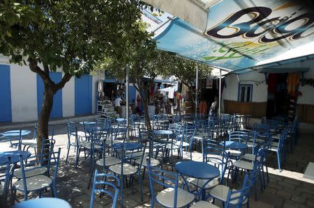 Empty tables are seen at the terrace of a coffee shop in Sidi Bou Said, a popular tourist destination near Tunis, Tunisia July 7, 2015. REUTERS/Zoubeir Souissi