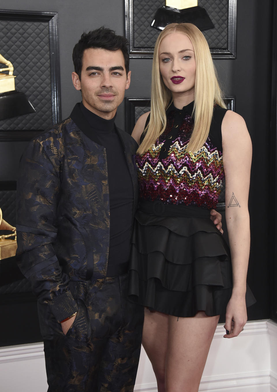 FILE - Joe Jonas, left, Sophie Turner arrive at the 62nd annual Grammy Awards in Los Angeles on Jan. 26, 2020. Turner and Joe Jonas have had their first child. The 24-year-old “Game of Thrones” star Turner and the 30-year-old singer Jonas announced the birth Monday. In a joint statement released by his label Republic Records, the two said only that they are "delighted to announce the birth of their baby.” They gave no further details on the child. (Photo by Jordan Strauss/Invision/AP, File)