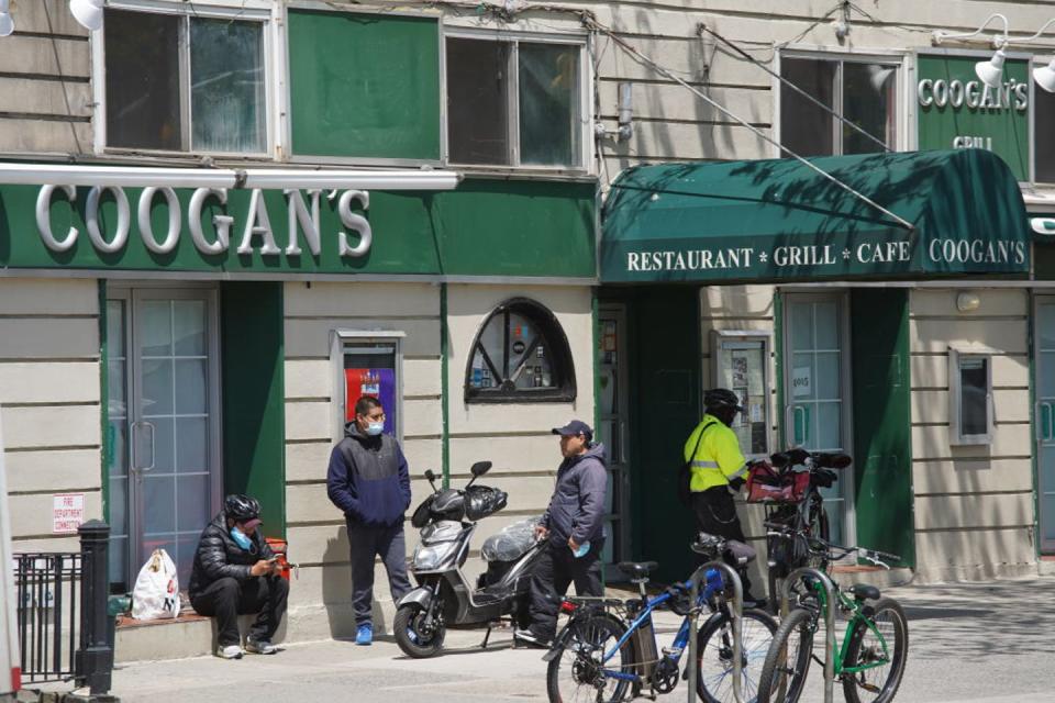 People congregate outside Coogan's restaurant.