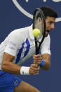 Novak Djokovic, of Serbia, returns a shot by Milos Raonic, of Canada, during the finals of the Western & Southern Open tennis tournament Saturday, Aug. 29, 2020, in New York. (AP Photo/Frank Franklin II)