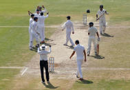 Cricket - India v England - Second Test cricket match - Dr. Y.S. Rajasekhara Reddy ACA-VDCA Cricket Stadium, Visakhapatnam, India - 20/11/16. England's players celebrate the dismissal of India's Wriddhiman Saha. REUTERS/Danish Siddiqui