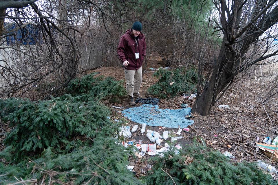 Shaun Hutchinson, director of Bergen County’s Division of Veteran Services, looks at a homeless encampment during the county's annual single-day count of homeless people Wednesday.