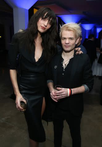 <p>Phillip Faraone/Getty</p> Ariana Cooper and Deryck Whibley in Los Angeles in February 2019