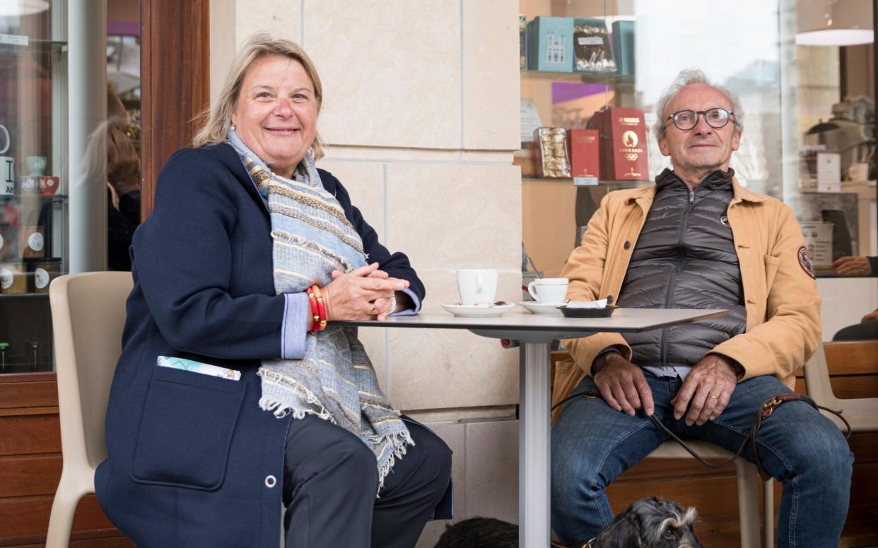 Retired vet Yannick André, left, said she continued to admire Mr Macron, who she knew as a child