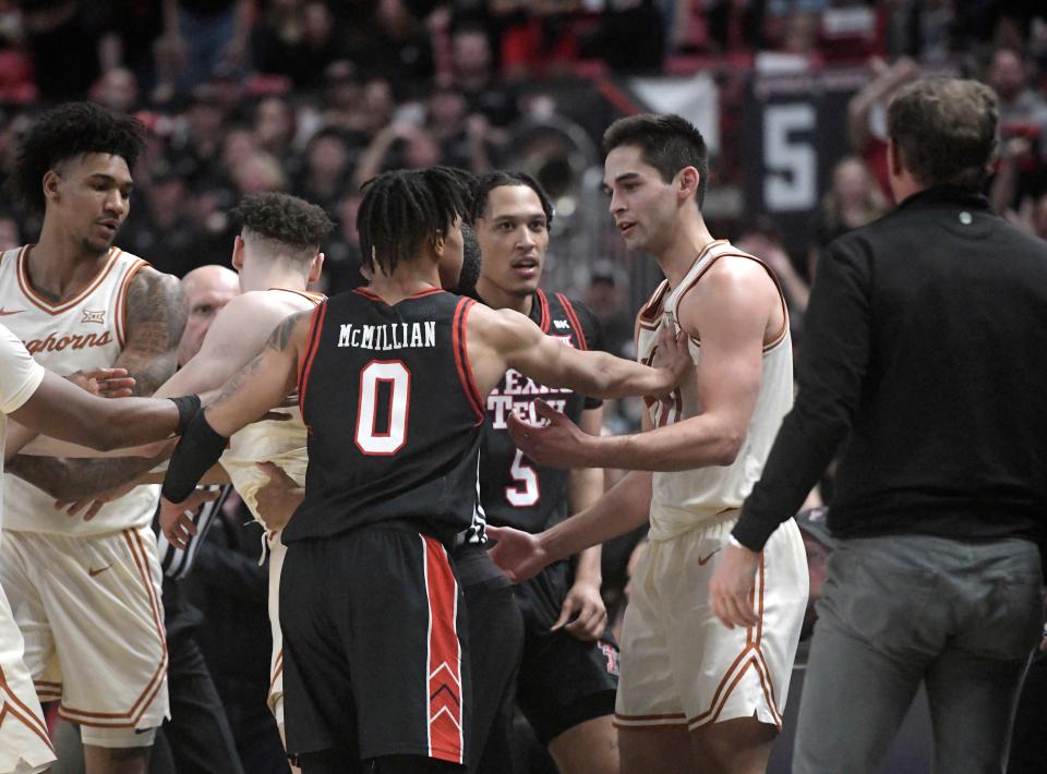 Texas Tech's guard Chance McMillian, left, shoves Texas forward Brock Cunningham during the Longhorns' win in Lubbock last month. The two longtime rivals could meet again at the Legends Classic in Brooklyn next season.