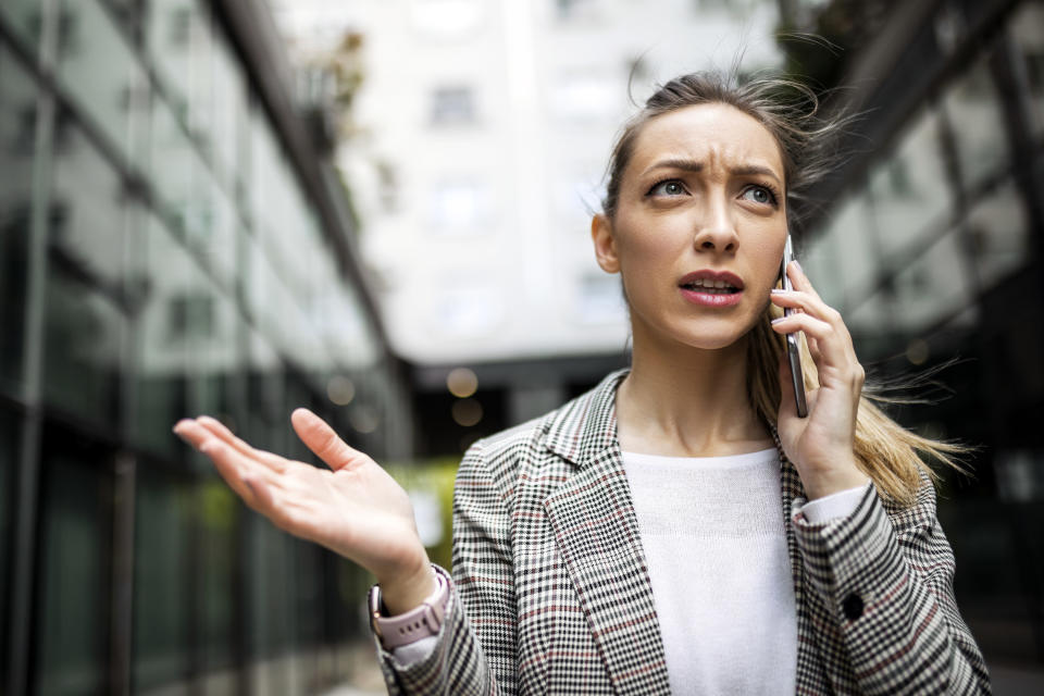 angry businesswoman talking on the phone