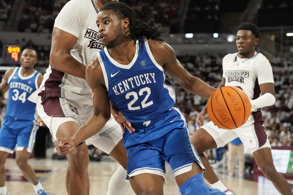 Kentucky guard Cason Wallace (22) presses against Mississippi State forward Tolu Smith (1) as he tries to drive towards the basket during the first half of an NCAA college basketball game in Starkville, Miss., Wednesday, Feb. 15, 2023. (AP Photo/Rogelio V. Solis)