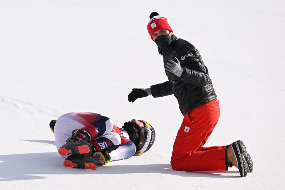 Seen here, a medical staff member tends to USA's Nina O'Brien after she crashed in the second run of the women's giant slalom at the Winter Olympics.