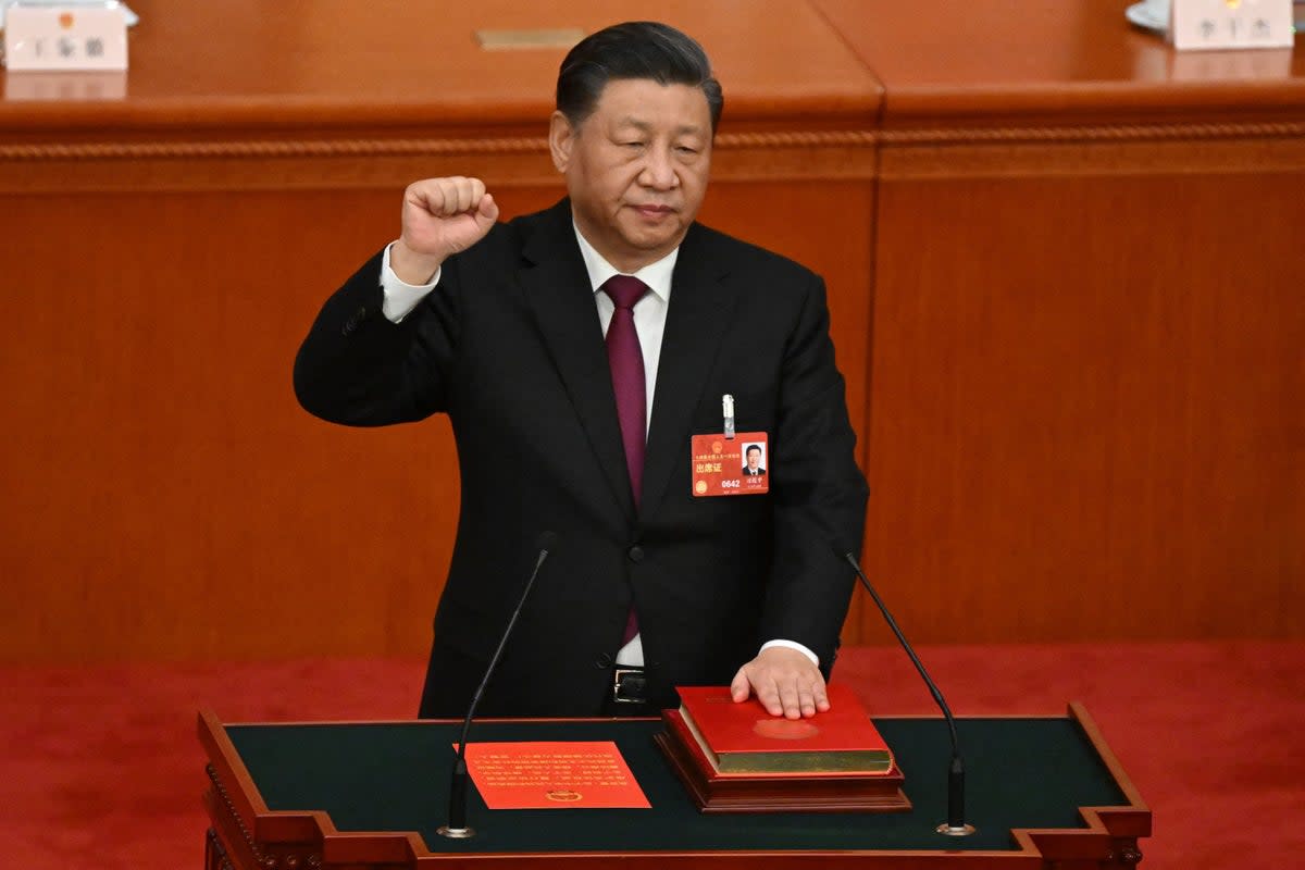 China's President Xi Jinping swears under oath after being re-elected (AFP via Getty Images)