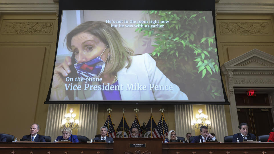 A video of  Speaker of the House Nancy Pelosi plays above members of the House Jan.6 committee during a public hearing. 