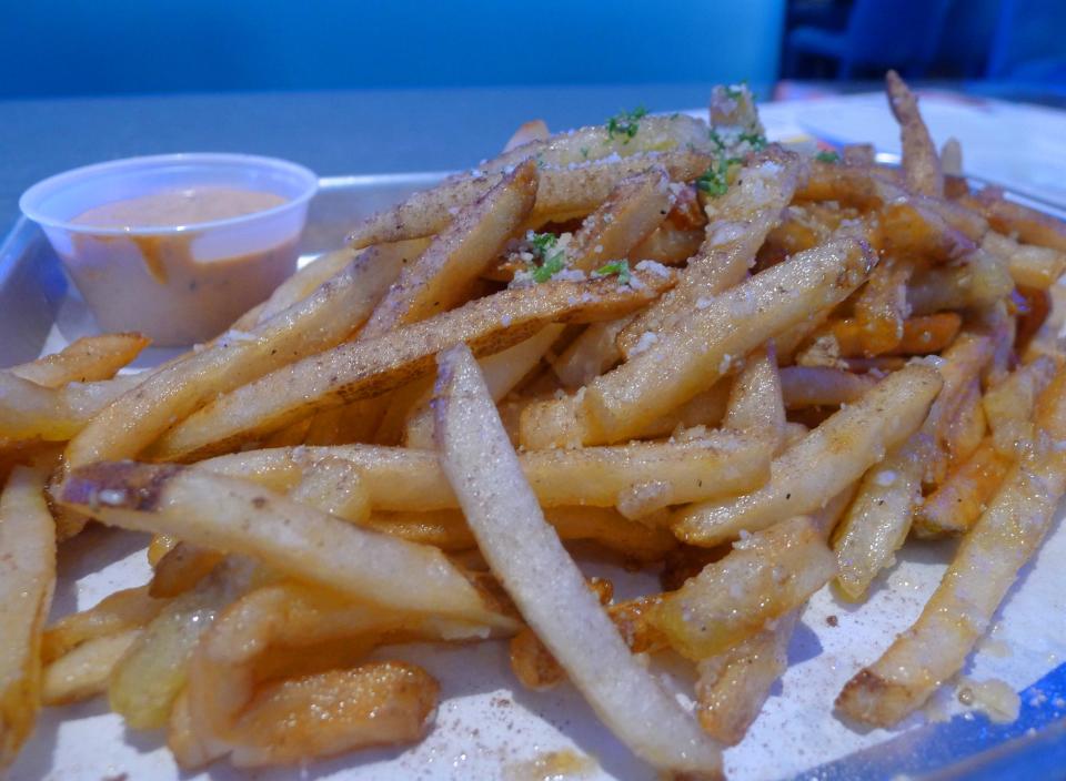Garlic Parmesan truffle fries are on the menu at Dave & Buster's outside Jordan Creek Town Center in West Des Moines.