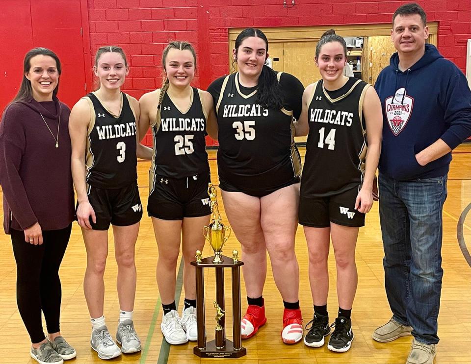 Western Wayne seniors accept this year's trophy for winning the 2023 Jaycees Holiday Tournament. Lady 'Cat seniors are (from left): Allie Pauler, Brooke Kellogg, Stephanie Mildner, Emily Romanowski.
