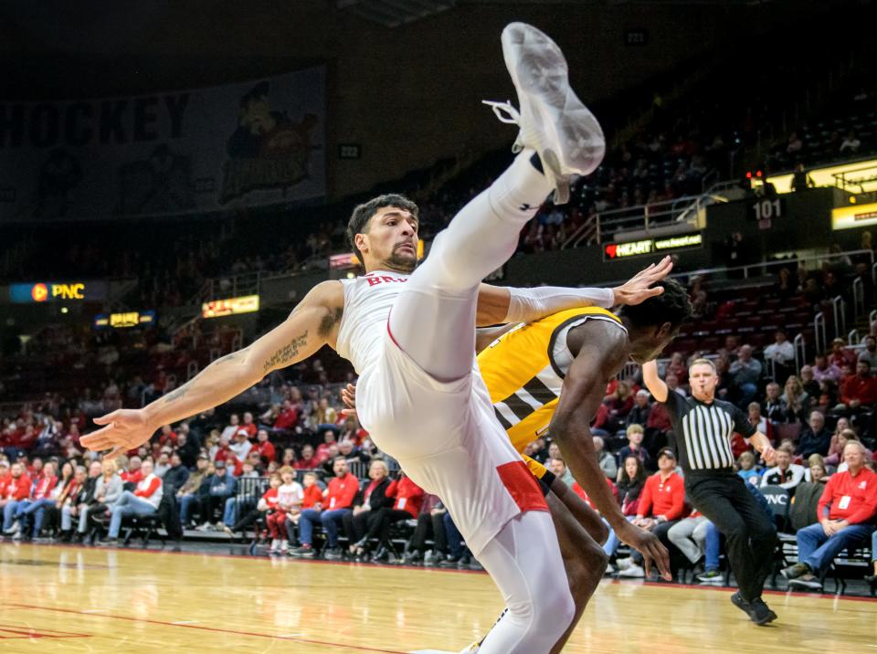Bradley's Ja'Shon Henry, left, loses his feet on a flagrant foul from Valpo's Ibra Bayu in the first half Saturday, Jan. 7, 2023 at Carver Arena. The Braves defeated the Beacons 88-66.