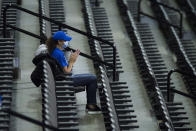 A Creighton fan celebrates a basket against Kennesaw State during the first half of an NCAA college basketball game in Omaha, Neb., Friday, Dec. 4, 2020. (AP Photo/Kayla Wolf)