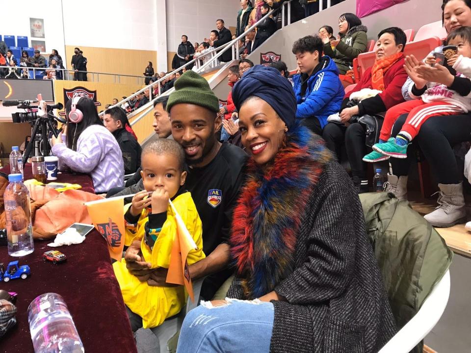 Imani Basheer attends a football game in Wuhan, China, with her husband and son. The family was forced to sell their belongings after the coronavirus outbreak locked down the city. (Photo: Photo provided by Imani Basheer)