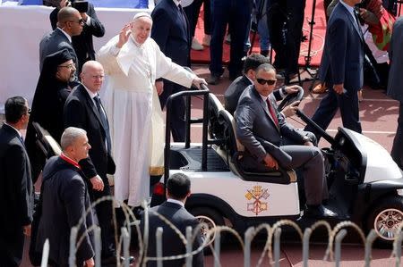 Pope Francis gestures as he arrives to hold a mass in Cairo, Egypt April 29, 2017. REUTERS/Amr Abdallah Dalsh