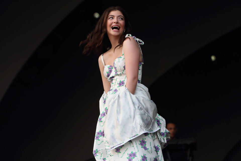 A closeup of Lorde performing